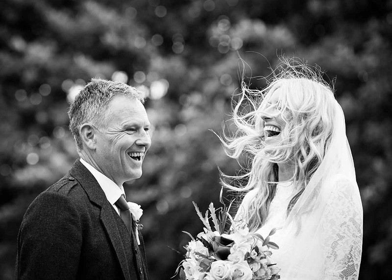 Black and white photo of couple laughing